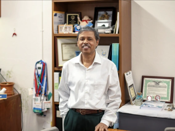 Prof in office with white button down